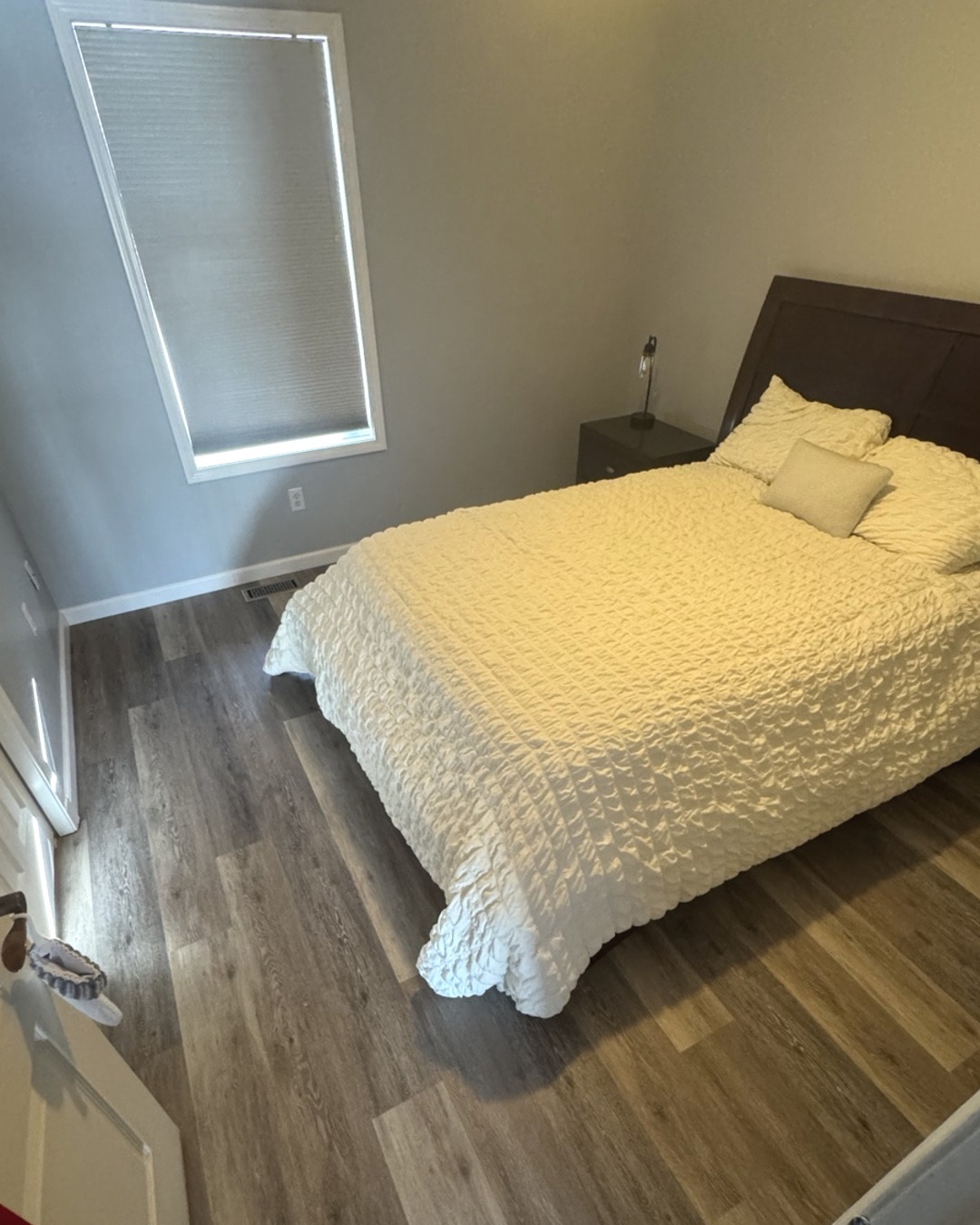 Finished wood-look flooring in a bedroom